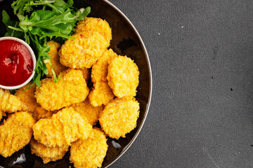 Chicken nuggets fast food natural tasty appetizer fresh delicious gourmet food background on the table rustic top view copy space