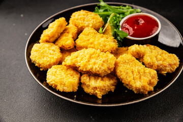 Chicken nuggets fast food natural tasty appetizer fresh delicious gourmet food background on the table rustic top view copy space