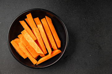 Raw sweet potato slices tasty snack fresh delicious gourmet food table background rustic top view copy space keto and paleo diet vegetarian and vegan food pescetarian diet