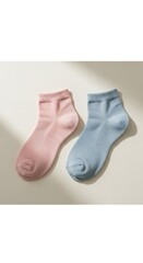 Pair of short ankle socks, one pink and one blue, displayed on a light surface