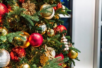 Christmas Tree Decorated with Red and Gold Ornaments