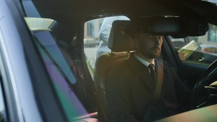 Professional male personal driver in uniform greeting business client boarding luxurious automobile then discussing destination point, premium customer service concept