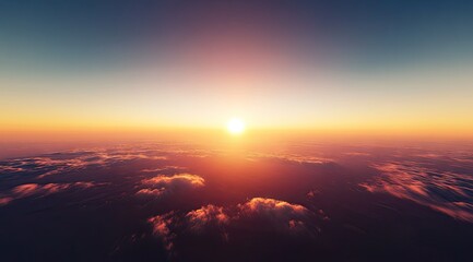 Aerial view of a fiery sunset over clouds