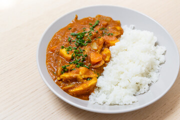 Close-up view of chicken curry with rice.