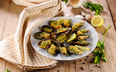 gratined mussel garnish with butter and herbs