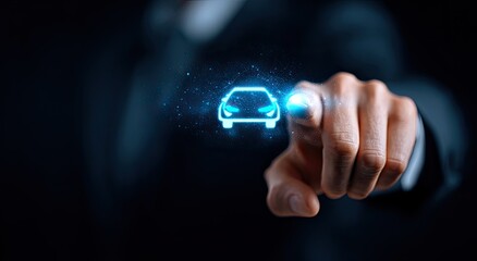 A person's finger points to a glowing, futuristic car icon, representing technology and transportation