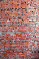 Old red brick wall texture with rough surface and natural worn details, perfect for backgrounds and design projects