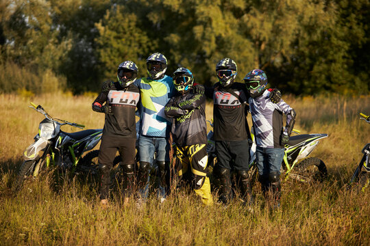 A group of enduro racers on enduro motorcycles. Photo of pit bike racers. Enduro motorcycle riders on the street. Motocross and stunt training. Kyiv, Ukraine