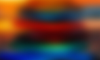 Abstract blurred background with vibrant hues of red orange and blue