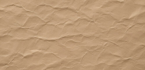 Brown wrinkled paper texture background close up detail, showing natural folds and creases with rich earthy tones that emphasize its raw organic visual character.