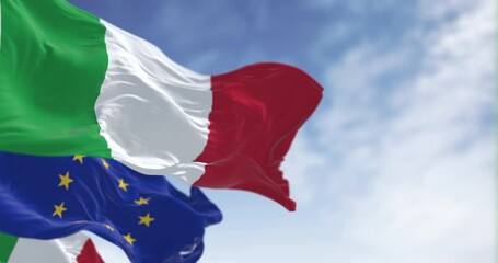 Italy and European Union flags waving on a clear day - Powered by Adobe