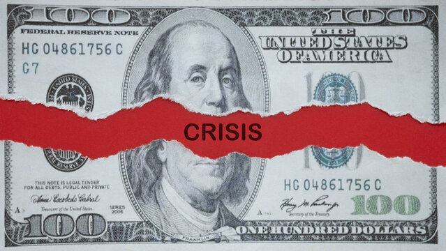 Torn U.S. dollar banknote revealing a red strip with the word CRISIS, symbolizing financial collapse, economic downturn, inflation pressure, and market instability in a dramatic business concept.