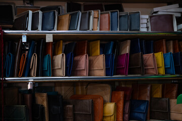 Colorful Vibrant leather handmade Moroccan bags, goods for sale in traditional local souk, story...