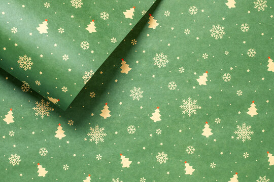 Green Christmas background with snowflakes and christmas trees,seamless pattern of christmas trees and snowflakes on green background,Christmas wrapping paper, Xmas pattern with ornaments.