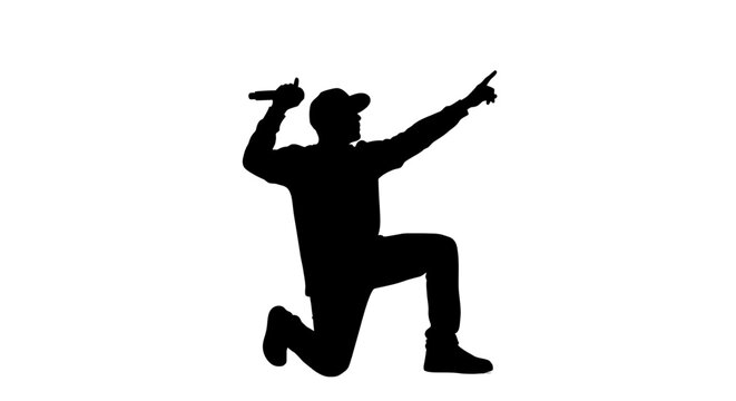 Dynamic silhouette of a hip hop artist performing live with a microphone, capturing the energy and passion of a modern concert or urban music scene.