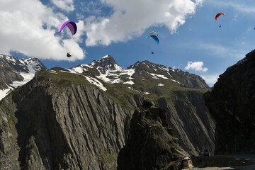 Tourists paragliding 3 pm 6 june 2025 at Leh Ladakh with view of Himalayan mountain range.