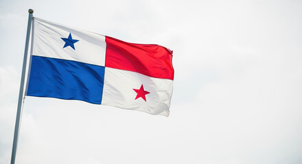 Naklejka premium Celebrating Panama Independence Day with Panamanian flag waving gently in breeze against cloudy sky. Panama Independence Day symbolizes patriotism and cultural identity.