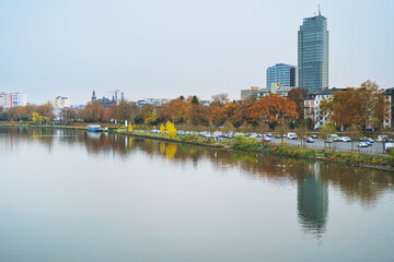 Naklejka premium Autumn and river water in Offenbach am Main harbor, Hesse.