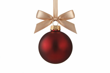 Deep red Christmas bauble with gold ribbon bow on white background Christmas ornament red bauble