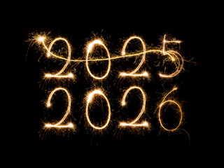 Happy New Year 2026. Burning sparkling text 2026 isolated on black background.