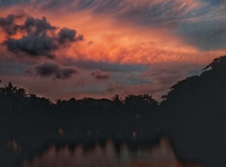 Sunset over tropical landscape with vibrant sky