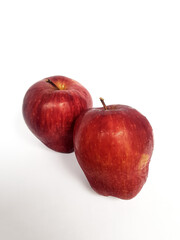 Close Up of Two Ripe Red Gala Apples with Stems, white background