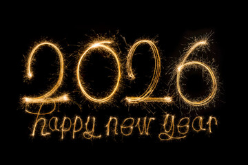 Happy New Year 2026. Burning sparkling text 2026 isolated on black background.