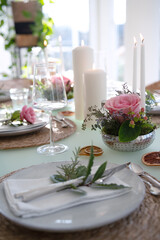 A festively set table for a wedding dinner. Tastefully decorated restaurant background with short depth of field.