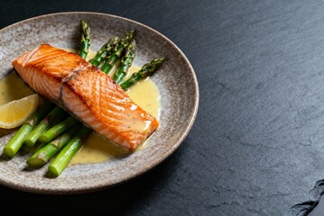 Gourmet seared salmon with asparagus, ideal for restaurant menus, food magazines, and culinary blogs. Professional high-resolution food photography with cinematic lighting.