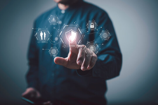 A business professional interacts with a digital security interface, highlighting data protection, cybersecurity, and secure access technology for modern networks and advanced IT systems.