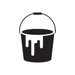 A black paint bucket with white paint dripping down the side isolated on a white background view
