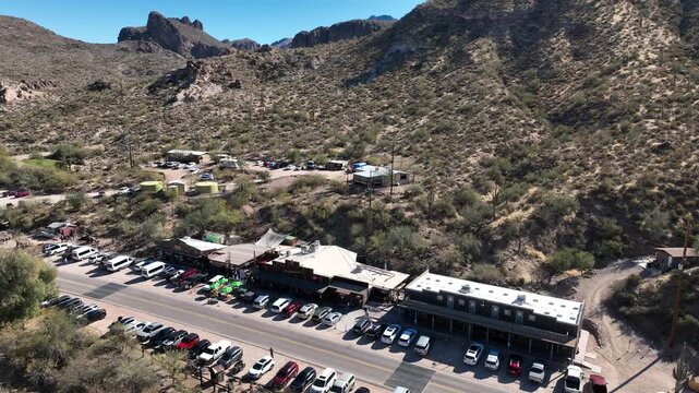 Aerial view of Goldfield Ghost Town nestled in a desert landscape, with cars parked along the road, Apache Junction, Arizona, United States.