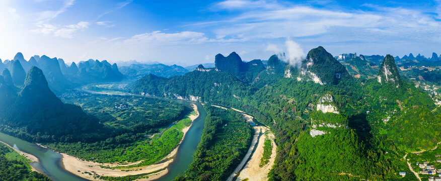 Aerial shot of the spectacular karst mountain and river with green valley landscape in Guilin, China.