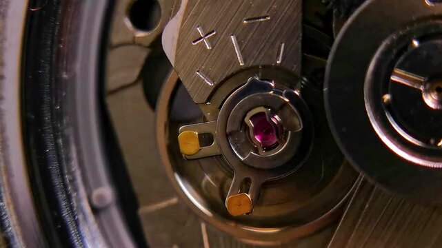 Macro View of Watch Regulation System and Oscillating Components with changing lighting