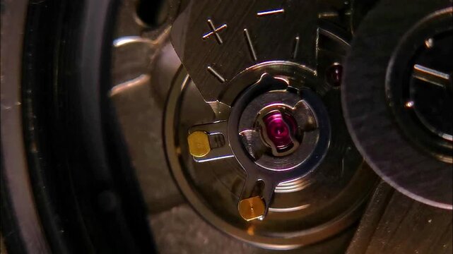 Macro Footage of Automatic Watch Escapement and Jewel Bearing with changing lighting