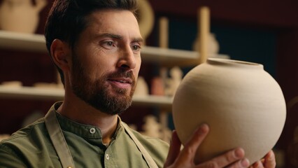 Happy laughing Caucasian man male guy small business owner craftsman potter businessman adoring...