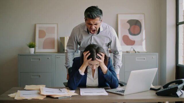 Stressed office worker golding head with hands and angry screaming supervisor standing behind and giving more workload and pressure.Slow Motion Video.AI Generative.