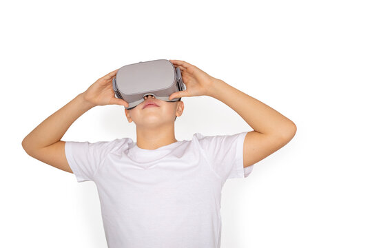Teen boy raising vr headset looking up