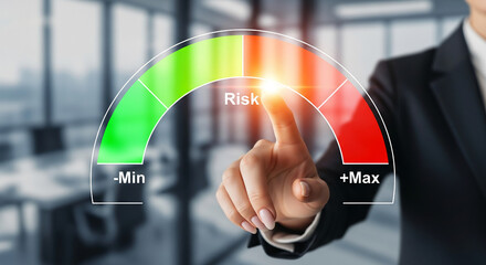 Hand touching a risk gauge with green (min) to red (max) zones, representing control, management, or assessment in a business or financial context