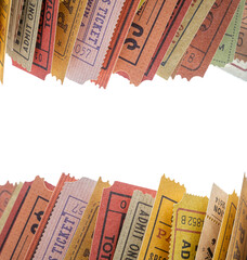 Old tickets stuck between the pages of a rolled-up magazine, close up view