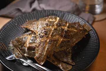 Baked flounder fish on a plate