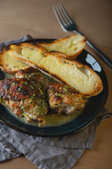 Baked chicken pieces in a creamy sauce with aromatic herbs