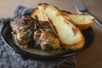 Baked chicken pieces in a creamy sauce with aromatic herbs