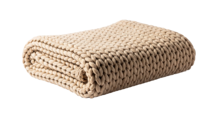 Folded beige knitted blanket, a cozy and warm textile for snuggling up on the couch or bed on a cold winter day