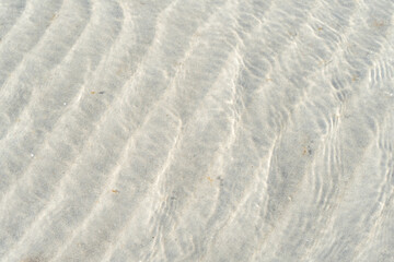 Shallow water soft sand and Baltic Sea coastal structures combine to create a gentle natural beach atmosphere