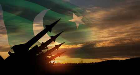 The missiles are aimed at the sky at sunset with Pakistan flag. Nuclear bomb, chemical weapons, missile defense, a system of salvo fire.