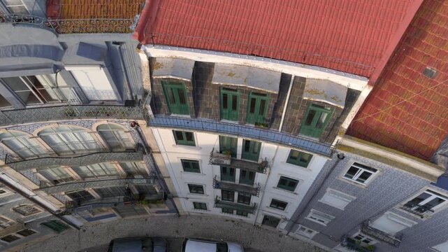 Curvy Street in Lisbon with Azulejo Fascades. Aerial Shot of Traditional Portuguese Houses decorated with Ceramic Tiles