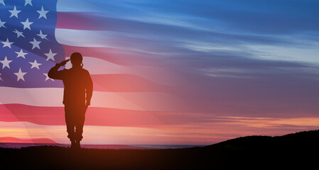 Silhouette of soldier saluting on background of sunset or sunrise and USA flag. Greeting card for Veterans Day, Memorial Day, Independence Day. America celebration.