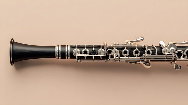 A black clarinet with silver keys isolated on a neutral background