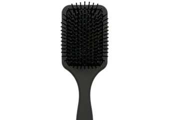 Black paddle hairbrush for detangling and smoothing hair care isolated on transparent background
